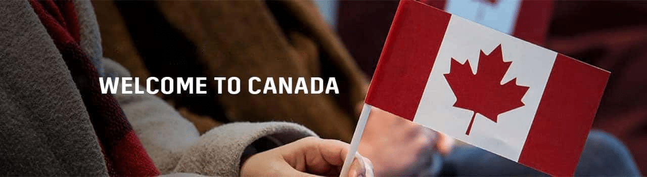 Person holding a small Canadian flag with the text "Welcome to Canada" in the background, symbolizing Canadian culture and hospitality for newcomers.