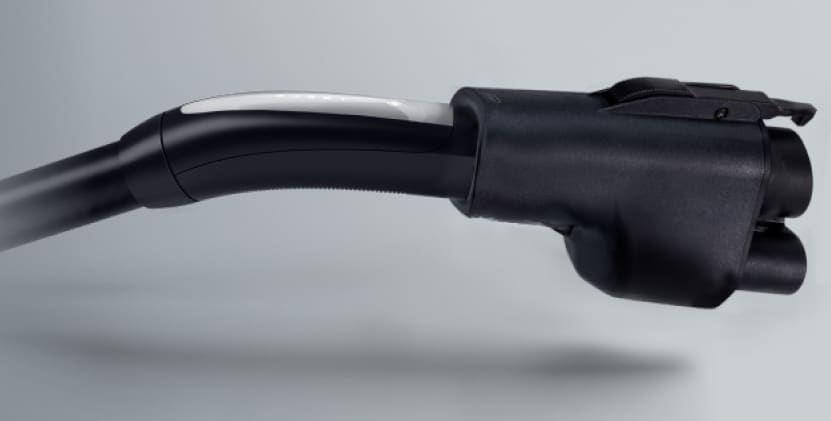 Electric vehicle charging connector with a sleek black design, highlighting its ergonomic shape and modern features for efficient charging.