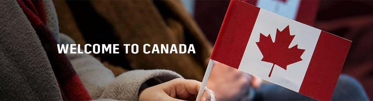 Person holding a small Canadian flag, symbolizing welcoming newcomers to Canada, with the text "Welcome to Canada" in the background.