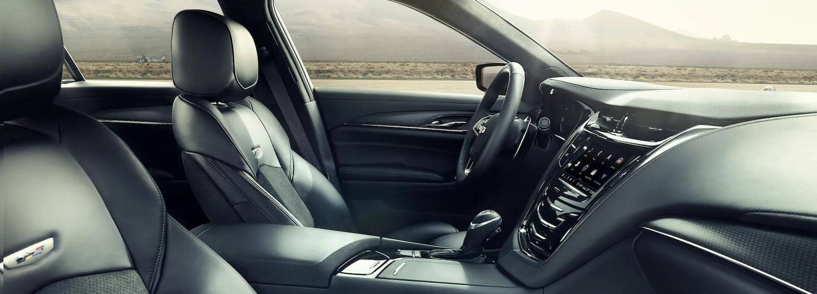 Interior view of a luxury car featuring premium leather seats, a sleek dashboard with advanced infotainment system, and modern design elements, highlighting comfort and technology for an enhanced driving experience.